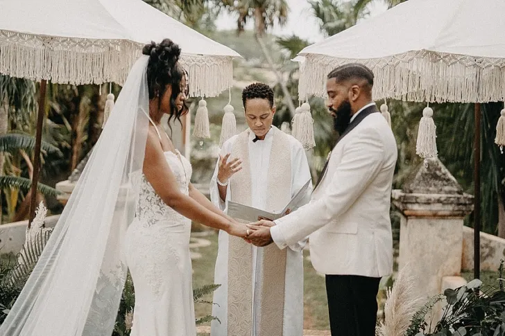 bride and groom holding hands during vows