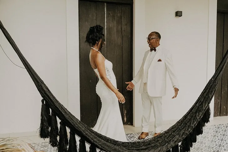 bride having a first look with father of the bride