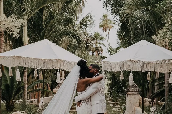 bride and groom kissing after wedding ceremony