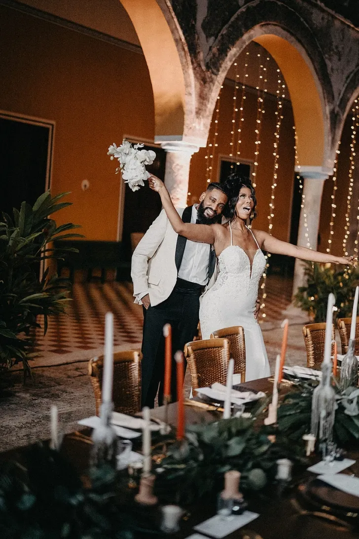 bride and groom laughing during wedding reception